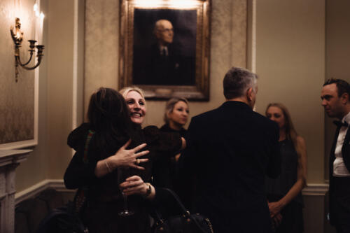 Aimee Anderson embracing Carole Siller McAlpine