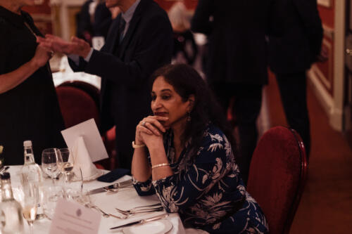 Lady Nina Bracewell-Smith seated at dinner